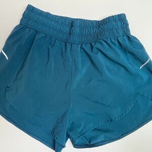 teal running shorts